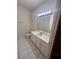 Simple bathroom with tile flooring, white vanity, mirror, and toilet at 284 Pinestraw Cir, Altamonte Springs, FL 32714