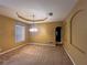 Dining room with elegant light fixture and arched doorway to the hall at 284 Pinestraw Cir, Altamonte Springs, FL 32714