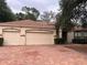 Charming single-story home featuring a brick driveway and a three-car garage at 284 Pinestraw Cir, Altamonte Springs, FL 32714