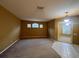 Spacious living room featuring plush carpeting and abundant natural light at 284 Pinestraw Cir, Altamonte Springs, FL 32714