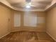 Bright main bedroom with ceiling fan, neutral walls and carpet, and plenty of natural light from two windows at 284 Pinestraw Cir, Altamonte Springs, FL 32714