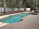 Sparkling pool with screened enclosure, providing a private and refreshing outdoor oasis for relaxation and entertaining at 284 Pinestraw Cir, Altamonte Springs, FL 32714