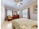 Spacious bedroom with large windows, tile floors and a ceiling fan at 1185 Coachwood Ct, Longwood, FL 32779