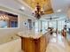 Eat-in kitchen boasts a large island and granite countertops at 1185 Coachwood Ct, Longwood, FL 32779