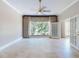 Bright living room featuring large windows and tile flooring at 1185 Coachwood Ct, Longwood, FL 32779