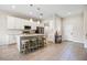 Spacious kitchen with a large island, stainless steel appliances, and ample cabinet space at 1302 Belmar Ter, Deltona, FL 32725