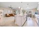 Bright living room area with a kitchen island, comfortable seating and natural light at 1302 Belmar Ter, Deltona, FL 32725