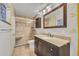 Bathroom with walk-in shower and granite vanity at 700 Melrose Ave J 1 Ave # J1, Winter Park, FL 32789