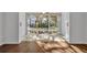 Bright dining area with wood-look floors and large windows overlooking a lush courtyard at 700 Melrose Ave J 1 Ave # J1, Winter Park, FL 32789