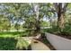 Landscaped grounds with a large oak tree and a walking path at 700 Melrose Ave J 1 Ave # J1, Winter Park, FL 32789