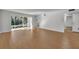 Living area with large window and wood-look tile floors at 700 Melrose Ave J 1 Ave # J1, Winter Park, FL 32789