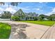 Two-story house with a wrap-around porch and landscaped lawn at 5155 Lake Deeson Woods Ct, Lakeland, FL 33805