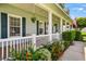 Front porch with white railing and flowerbeds at 5155 Lake Deeson Woods Ct, Lakeland, FL 33805