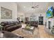 Bright living room featuring leather couches and high ceilings at 5155 Lake Deeson Woods Ct, Lakeland, FL 33805