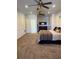 Large main bedroom with ensuite bathroom and two ceiling fans at 5155 Lake Deeson Woods Ct, Lakeland, FL 33805