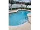 Relaxing kidney-shaped pool with tiled steps at 5155 Lake Deeson Woods Ct, Lakeland, FL 33805