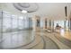 Elegant building lobby with seating area and large windows at 150 E Robinson St # 1907, Orlando, FL 32801