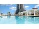 Resort-style pool with comfortable seating and city views at 150 E Robinson St # 1907, Orlando, FL 32801