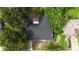 Aerial view of house and surrounding trees at 4410 Rossmore Dr, Orlando, FL 32810