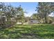 House with a large backyard and mature trees at 4410 Rossmore Dr, Orlando, FL 32810