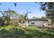 House with large backyard and mature trees at 4410 Rossmore Dr, Orlando, FL 32810