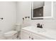 Clean bathroom with white vanity and dark tile accents at 4410 Rossmore Dr, Orlando, FL 32810