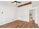 Spacious bedroom with hardwood floors, neutral walls and ceiling fan at 4410 Rossmore Dr, Orlando, FL 32810