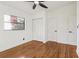 Bright bedroom with hardwood floors and built-in closet at 4410 Rossmore Dr, Orlando, FL 32810