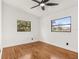 Spacious bedroom with hardwood floors and large windows at 4410 Rossmore Dr, Orlando, FL 32810