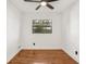 Simple bedroom with hardwood floors and a ceiling fan at 4410 Rossmore Dr, Orlando, FL 32810