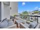 Private balcony with patio furniture and city views at 530 E Central Blvd # 201, Orlando, FL 32801