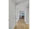 Bright hallway with light wood floors and white doors at 530 E Central Blvd # 201, Orlando, FL 32801