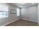 Clean bedroom with wood-look flooring, neutral walls, recessed lighting, and natural light from windows at 992 Jetway St, Orange City, FL 32763