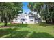 House with large backyard and mature trees at 216 N Saint Clair Abrams Ave, Tavares, FL 32778