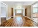 Hardwood floor dining room with built-in hutches and lots of natural light at 216 N Saint Clair Abrams Ave, Tavares, FL 32778