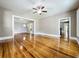 Large living area with hardwood floors and an open floor plan at 216 N Saint Clair Abrams Ave, Tavares, FL 32778