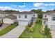Two-story home with a well-manicured lawn, two-car garage, enhanced by an inviting and appealing design at 1001 Rivers Crossing St, Clermont, FL 34714