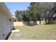 View of backyard with newly installed wooden fence and well-maintained lawn at 511 Reed Ne Ave, Oviedo, FL 32765