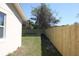 Green backyard showing the new wooden fence line and well-maintained lawn at 511 Reed Ne Ave, Oviedo, FL 32765