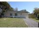 Charming single-story home with a well-maintained lawn and newly graveled driveway at 511 Reed Ne Ave, Oviedo, FL 32765