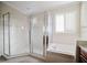 Bathroom with shower, tub, and window at 8162 Via Bella Notte, Orlando, FL 32836