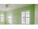 Bright bedroom featuring a ceiling fan and plantation shutters at 8162 Via Bella Notte, Orlando, FL 32836