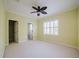 Bedroom with ceiling fan and access to bathroom at 8162 Via Bella Notte, Orlando, FL 32836