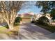 Front view of house showcasing garage and paved driveway at 8162 Via Bella Notte, Orlando, FL 32836