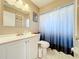 Clean bathroom with white vanity, shower/tub combo, and updated fixtures at 104 E Berkshire Cir, Longwood, FL 32779