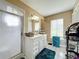 Clean bathroom with white vanity, shower, and tiled floor at 104 E Berkshire Cir, Longwood, FL 32779