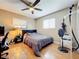 Bright bedroom with a double bed, ceiling fan, and wood floors at 104 E Berkshire Cir, Longwood, FL 32779