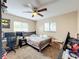 Bedroom with double bed, ceiling fan, and workspace at 104 E Berkshire Cir, Longwood, FL 32779