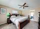 Spacious main bedroom with king-size bed and ensuite access at 104 E Berkshire Cir, Longwood, FL 32779
