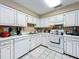 White kitchen with ample cabinetry, offering lots of storage space at 104 E Berkshire Cir, Longwood, FL 32779